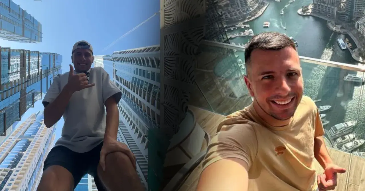 Uśmiechnięty mężczyzna na tle drapaczy chmur w Dubaju. Czy do Dubaju potrzebna jest wiza? Sprawdź sam!